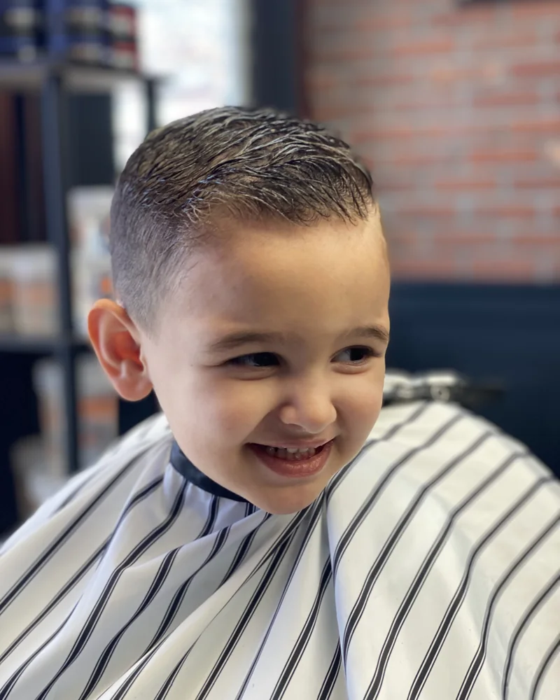 Laughing boy after a haircut