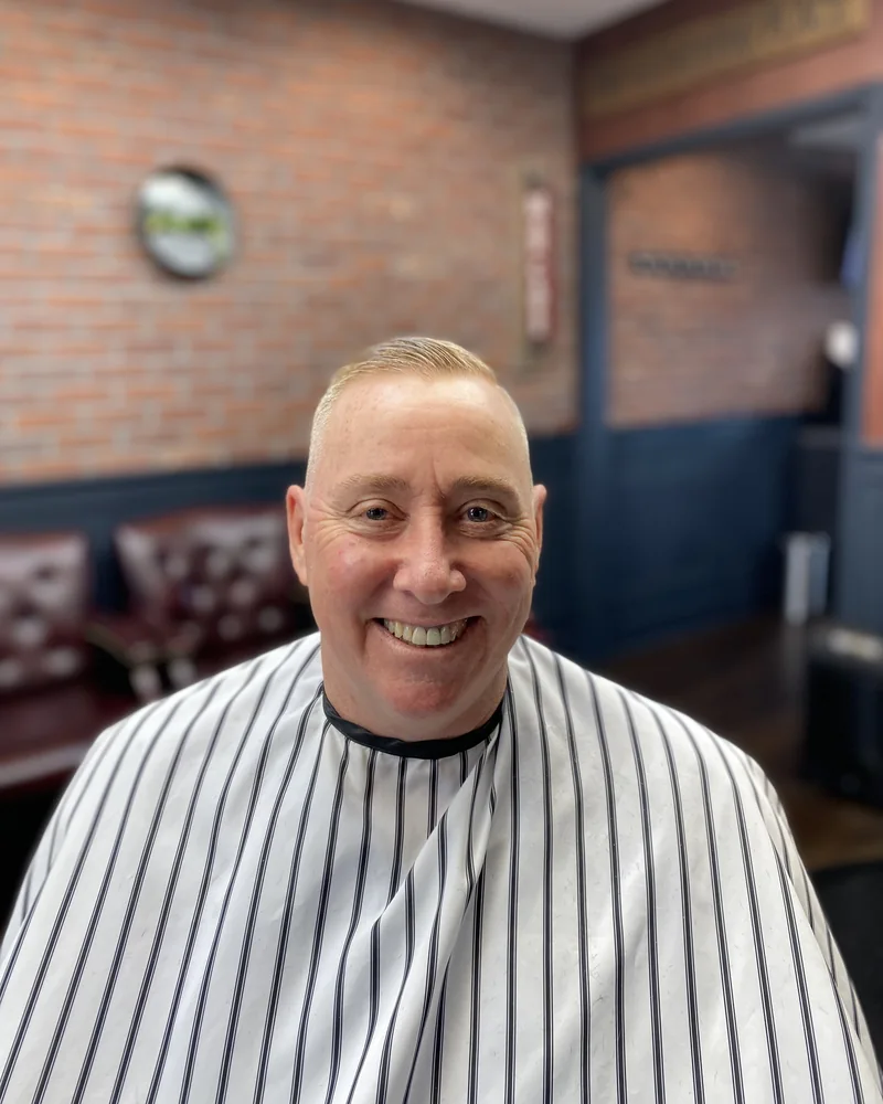 Customer smiling in the barber chair
