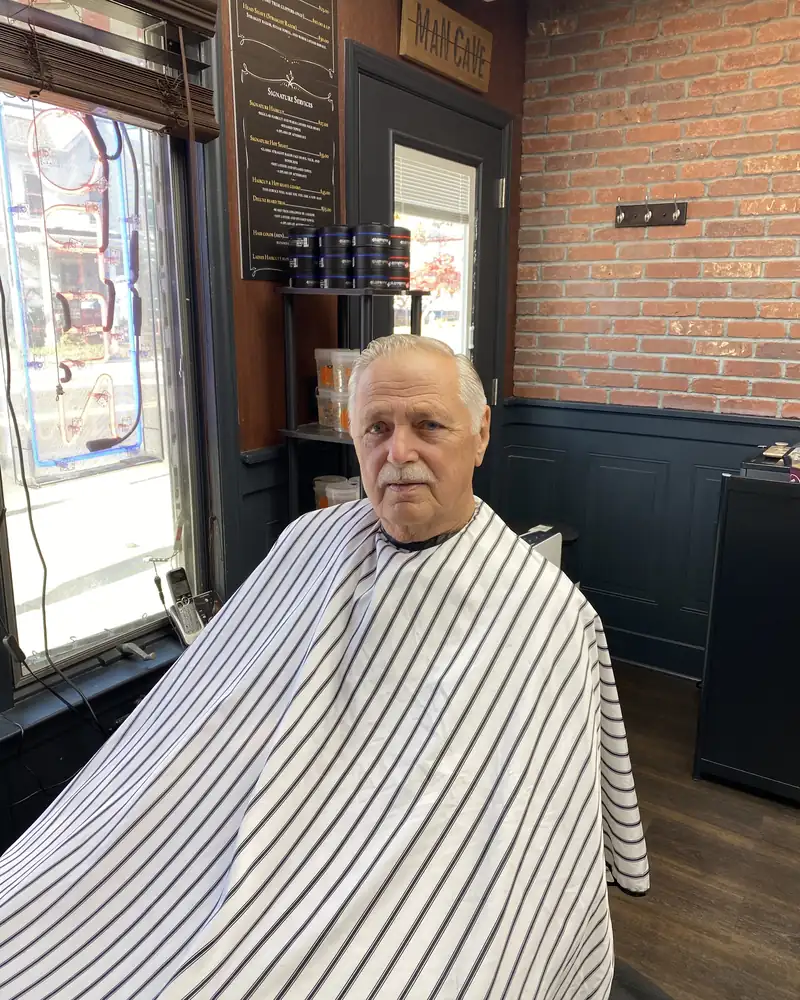 Customer in the chair by the window