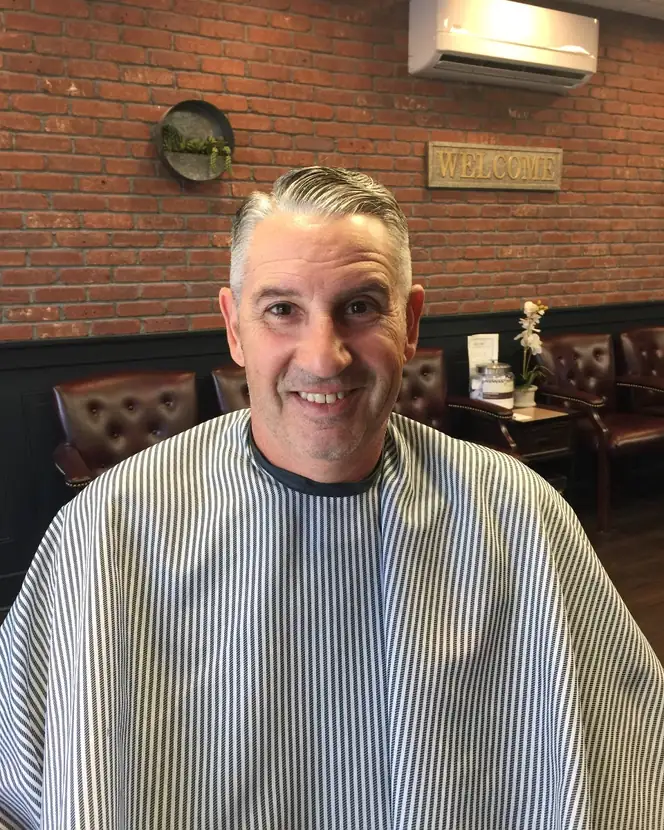 Smiling customer after a haircut